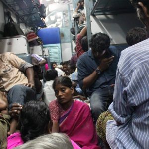 Migrant workers returning home in a train in Cochin, India.