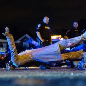 A statue of Confederate States President Jefferson Davis lies on the street after protesters pulled it down in Richmond, Virginia