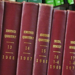 Photograph of journal bindings in an anthropology library, showing the transition where Eugenics Quarterly was renamed to Social Biology in 1969