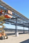 Construction workers complete electrical connections on phase 2 of a solar microgrid project at Fort Hunter Liggett, CA (March 12, 2013)