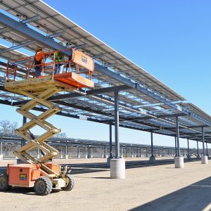 Construction workers complete electrical connections on phase 2 of a solar microgrid project at Fort Hunter Liggett, CA (March 12, 2013)