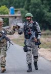 Soldiers from the U.S. Air Force and Pakistani Air Force bumping fists