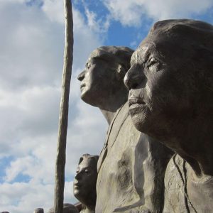 Clouds dance behind statues at the Chickasaw Cultural Center during the 2012 Trail of Tears Conference in Sulphur, Oklahoma near the Chickasaw National Recreation Area